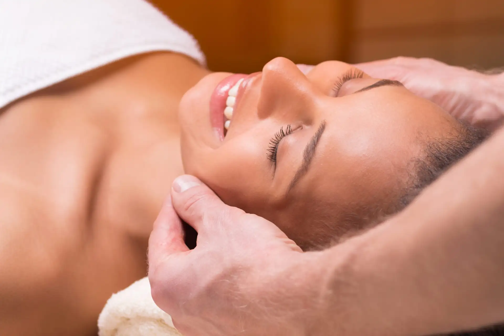 Beautiful woman having face massage with ND Acupuncturist